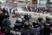 Riot police use water cannon against protesters during clashes outside parliament in Kathmandu, Nepal, on Sept. 8.