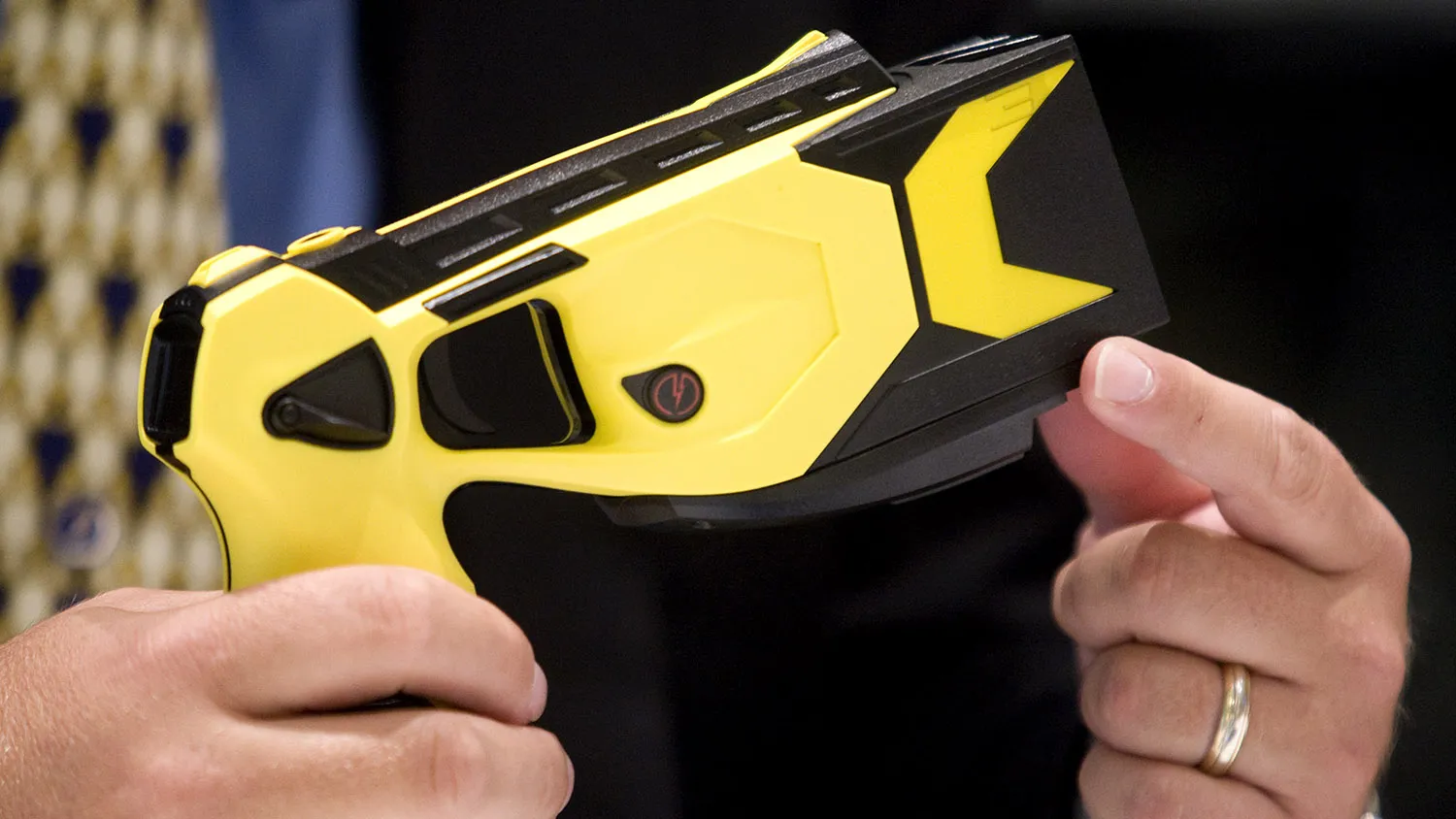 Thomas 'Tom' Smith, chairman and co-founder of Taser International Inc., holds a Taser X3 Electronic Control Device, ECD, during an interview in New York, U.S., on Wednesday, July 29, 2009.
