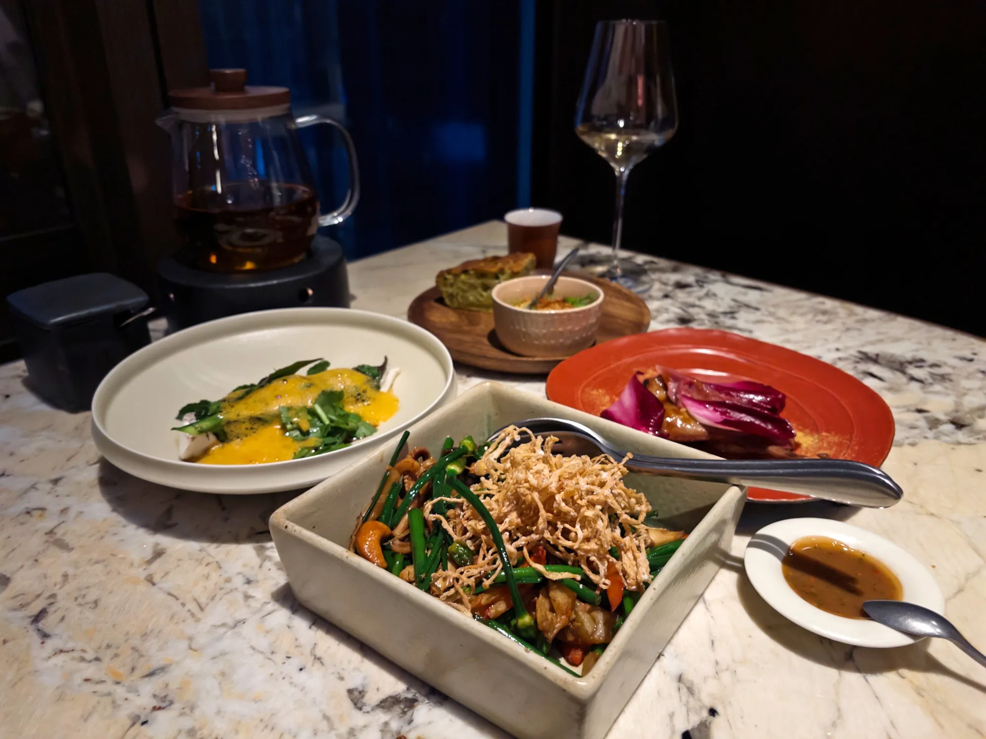 Chicken liver parfait, clockwise from top, roasted pigeon, stir-fried Chinese chives and Jizong mushrooms and steamed snapper at Jija.