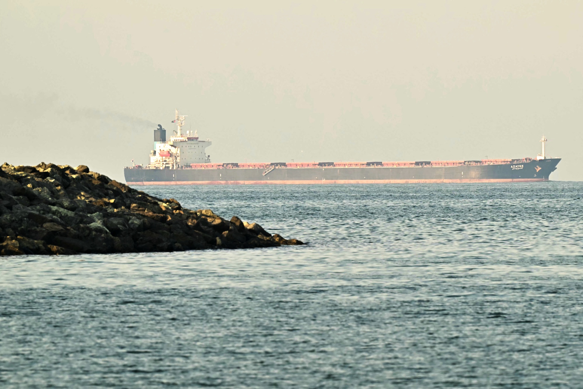 A cargo ship in the Strait of Hormuz near Fujairah. Photographer: Giuseppe Cacace/AFP/Getty Images