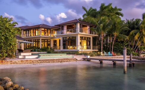 Johnny Lopez's Key Biscayne, Fla., mansion, with private dock, is on the market for $21 million. Lopez is a film producer and co-owner of the Detroit Pistons.