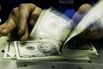 British Convert Pounds To U.S. Dollars