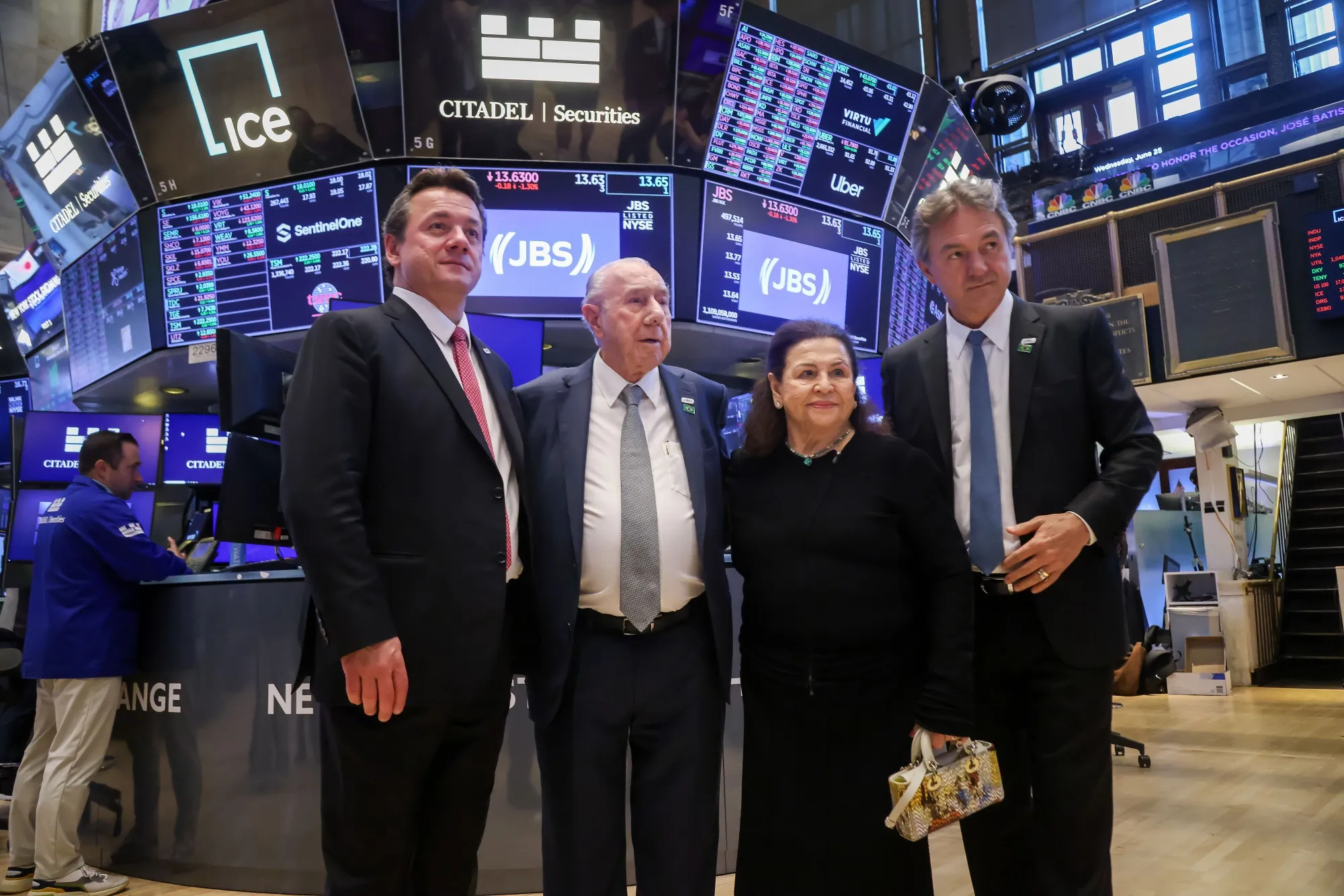 Wesley Batista, left, and his brother Joesley Batista, right, with their parents, Jose Batista Sobrinho and Flora Mendonca Batista on the floor of the New York Stock Exchange on June 25.