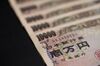 Japanese 10,000 yen banknotes are arranged for a photograph in Japan.