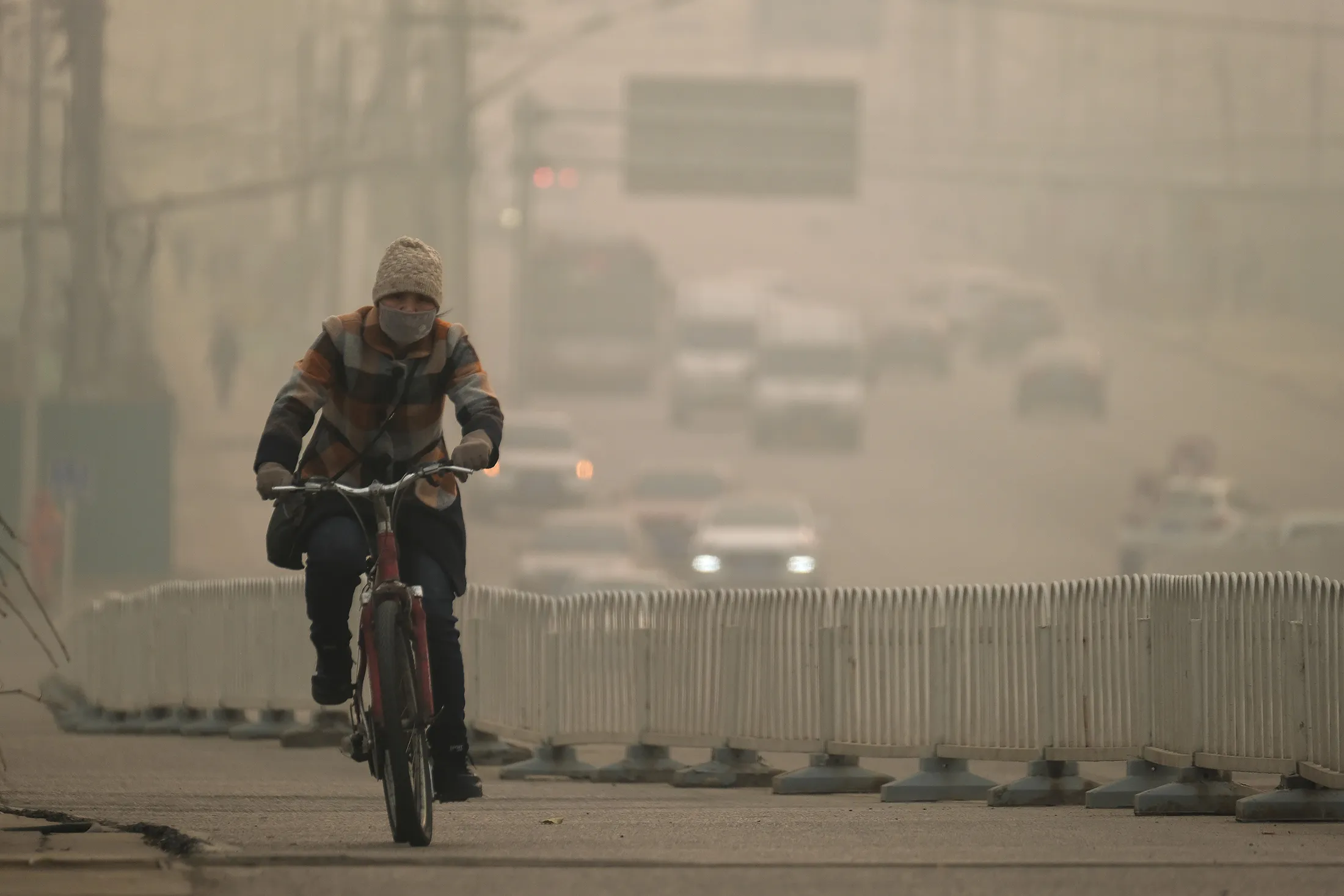 A cyclist rides on a street in Beijing on Nov. 26.