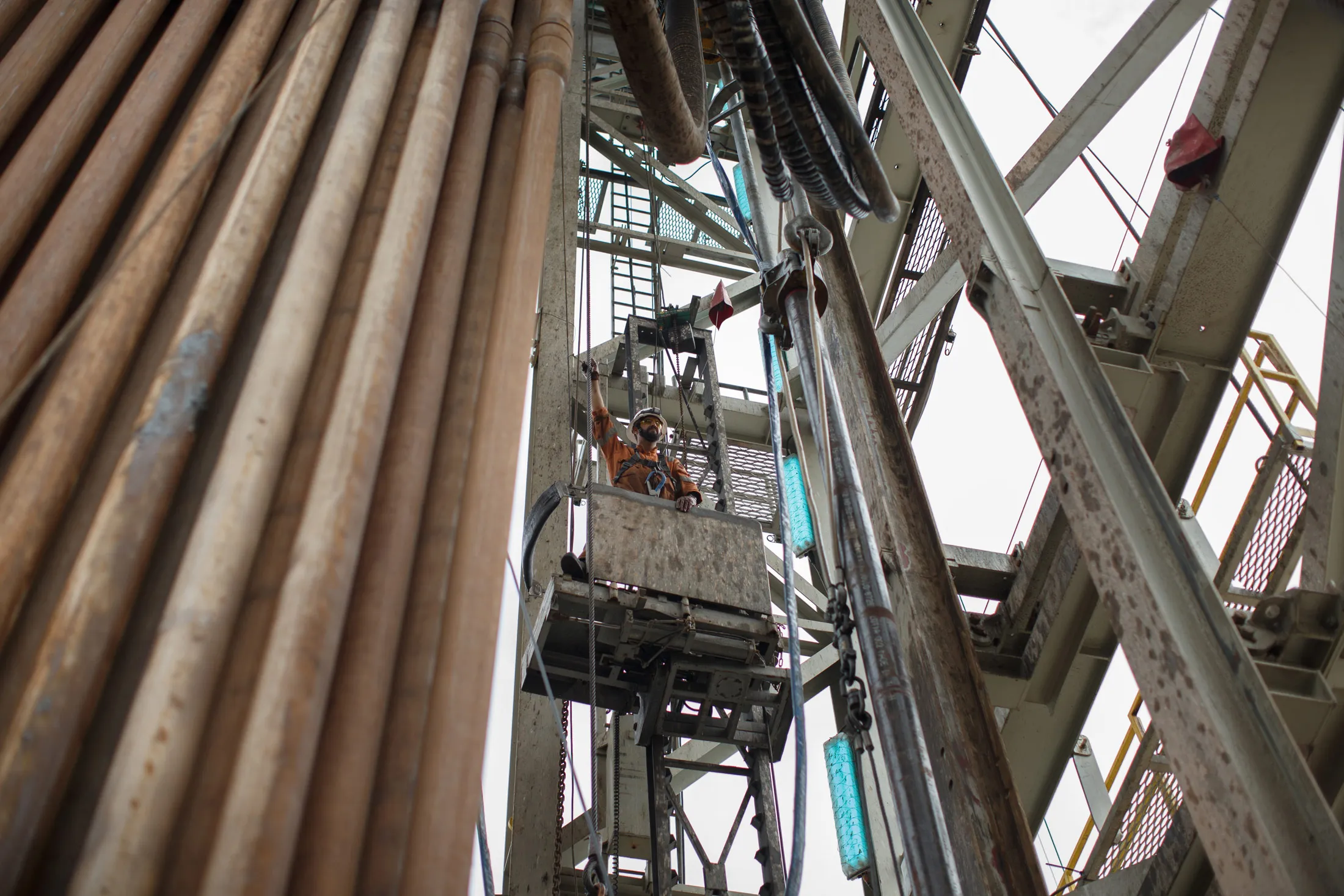 A worker stands on a drilling tower platform beside gas pipes during operations at the Boekelermeer gas storage site, operated by Abu Dhabi National Energy Co (Taqa) and EBN BV, the Dutch state-owned energy company, in Alkmaar.
