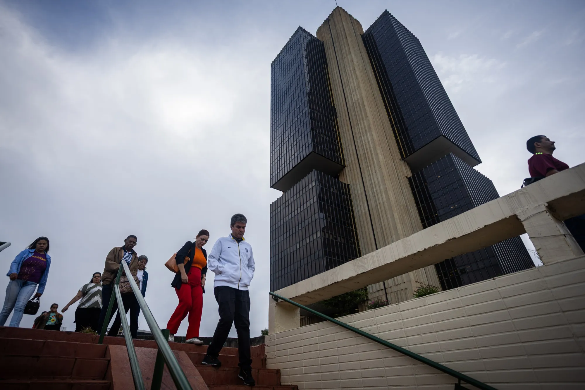 Commuters pass the Central Bank of Brazil in Brasilia.