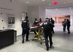 In this photo provided by Yuichi Shimada, medical personnel respond at the Museum of Modern Art in New York after a man stabbed two employees after he was denied entrance for previous incidents of disorderly conduct, Saturday, March 12, 2022. (Yuichi Shimada via AP)