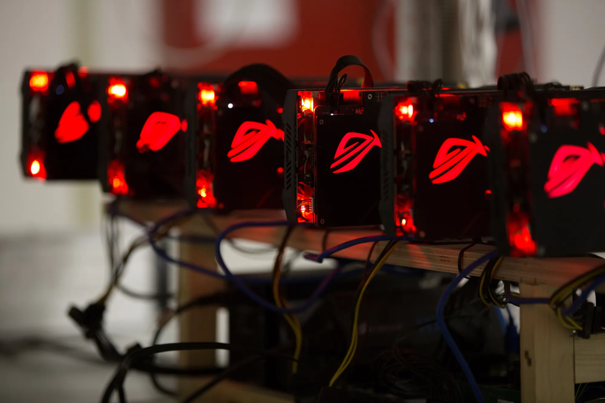 Red lights illuminate cryptocurrency mining rig units&nbsp;in Moscow.