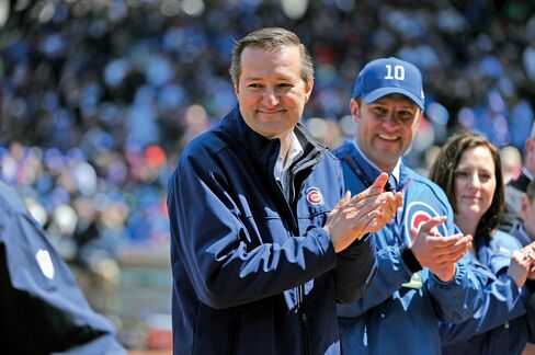 Tom Ricketts, left, attends a 2014 home game against the Arizona Diamondbacks.