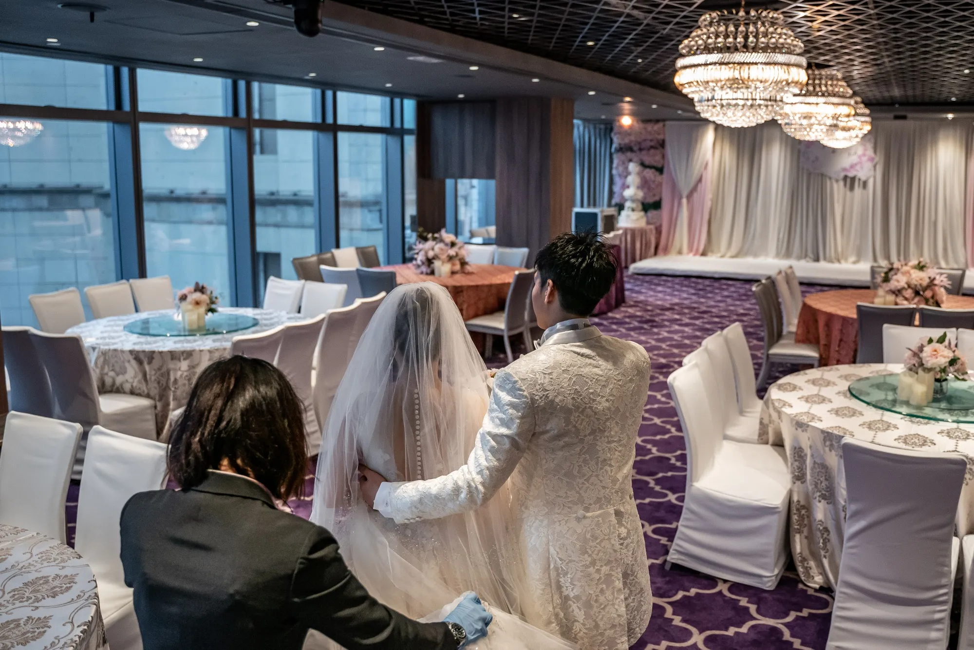 Newly-weds enter an empty room due to the government’s new social distancing rule, in Hong Kong on March 29.