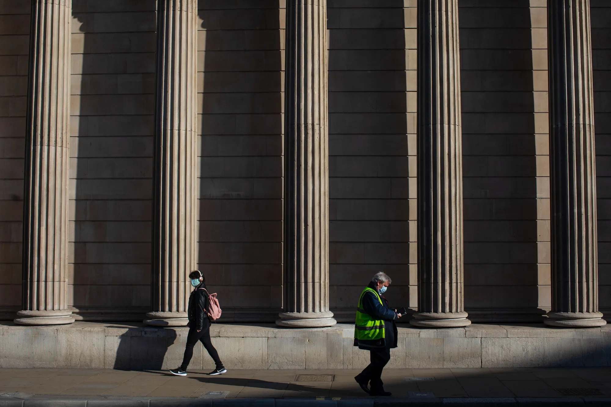 Pedestrians&nbsp;pass the Bank of England in London in May.