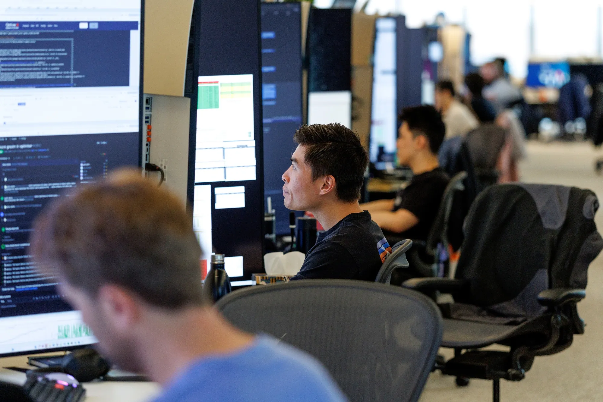 Optiver employees work on the trading floor. 