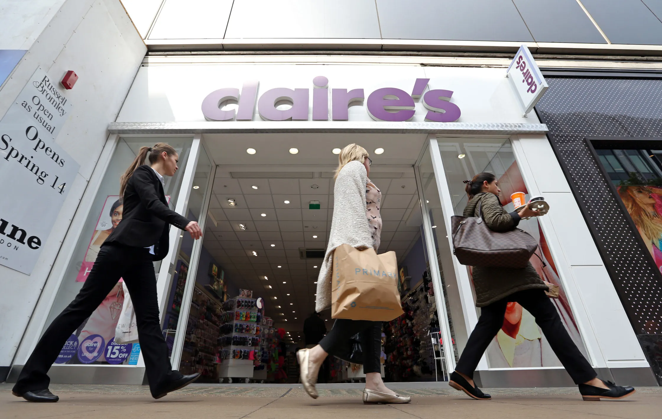 Pedestrians pass a Claire's Accessories store, operated by Claire's Stores Inc., on Oxford Street in London.