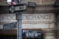 A Wall Street street sign in front of the New York Stock Exchange in New York.