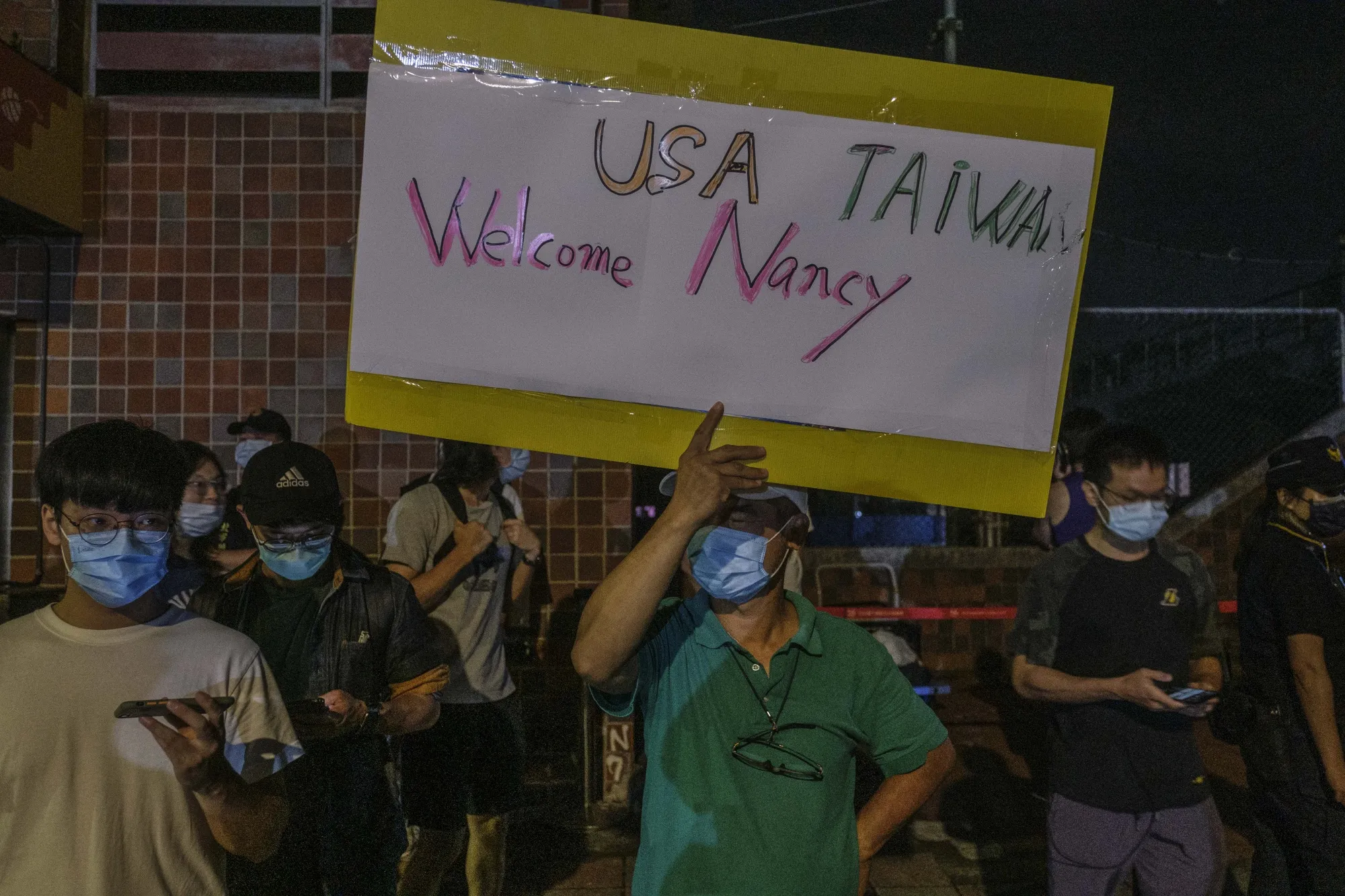 Supporters outside Songshan Airport as US House Speaker Nancy Pelosi's arrives in Taipei, Taiwan, on Tuesday.
