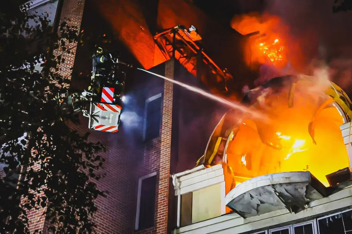 Firefighters tackle a blaze after a Russian attack in Kharkiv, Ukraine, in a photo released on June 20.