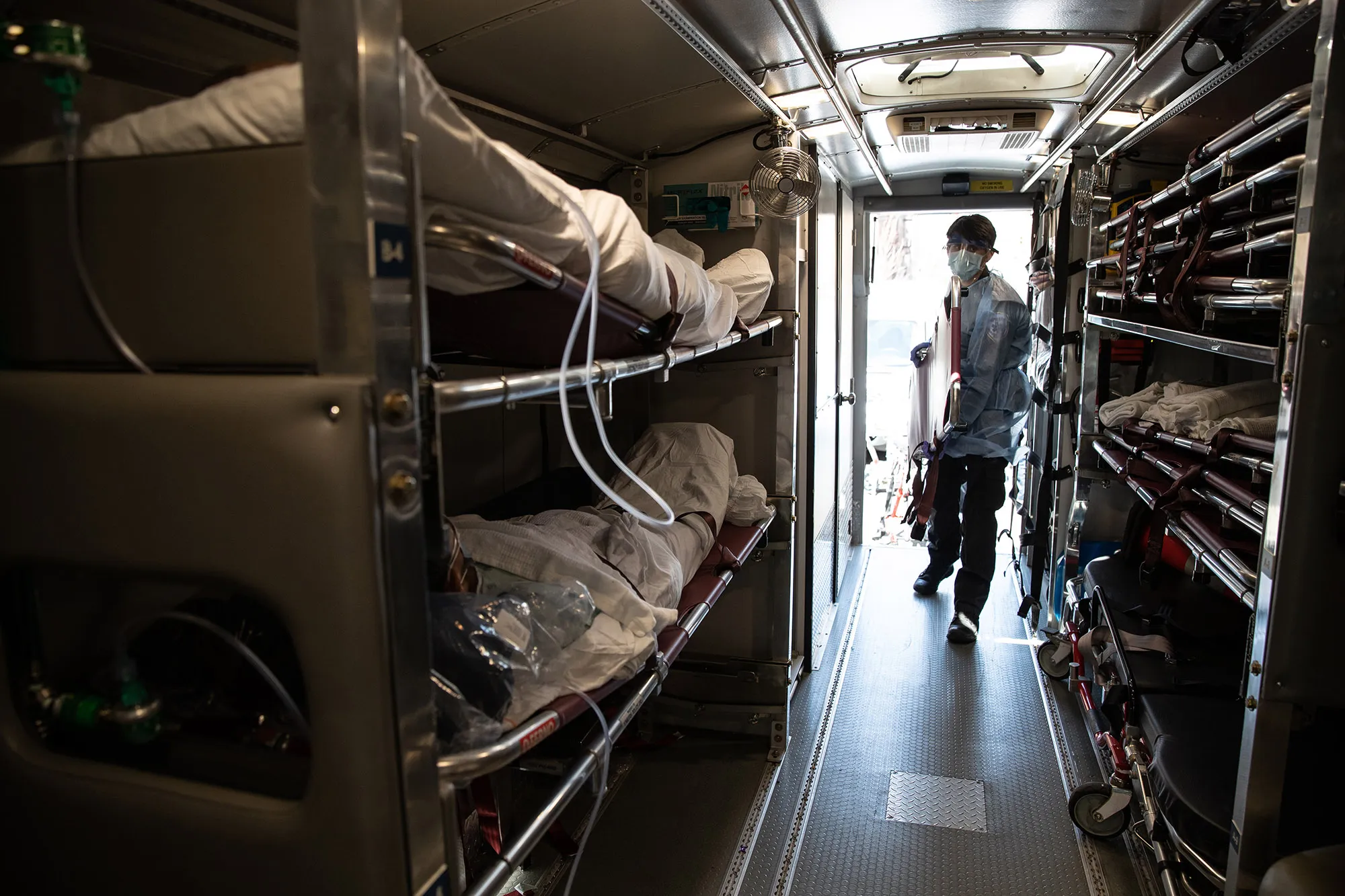 A medic prepares to unload Covid-19 patients arriving to the Montefiore Medical Center Moses Campus in the Bronx borough of New York City on April 7.