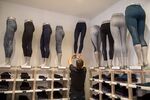 An employee moves a mannequin at a Lululemon Athletica Inc. store.