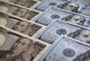 Japanese 10,000 yen and U.S. 100 dollar banknotes are arranged for a photograph in Tokyo, Japan.