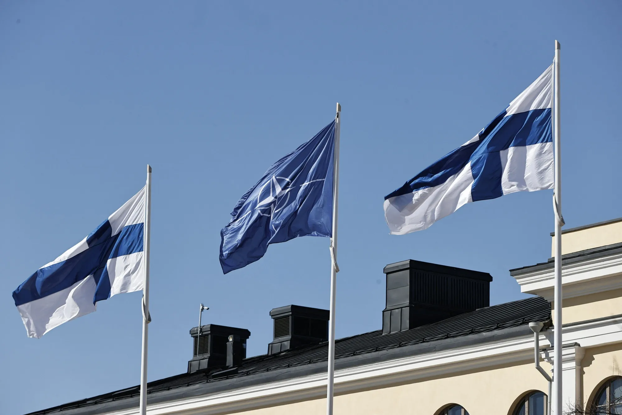 Finnish and NATO flags in&nbsp;the courtyard of the Foreign Ministry in Helsinki.