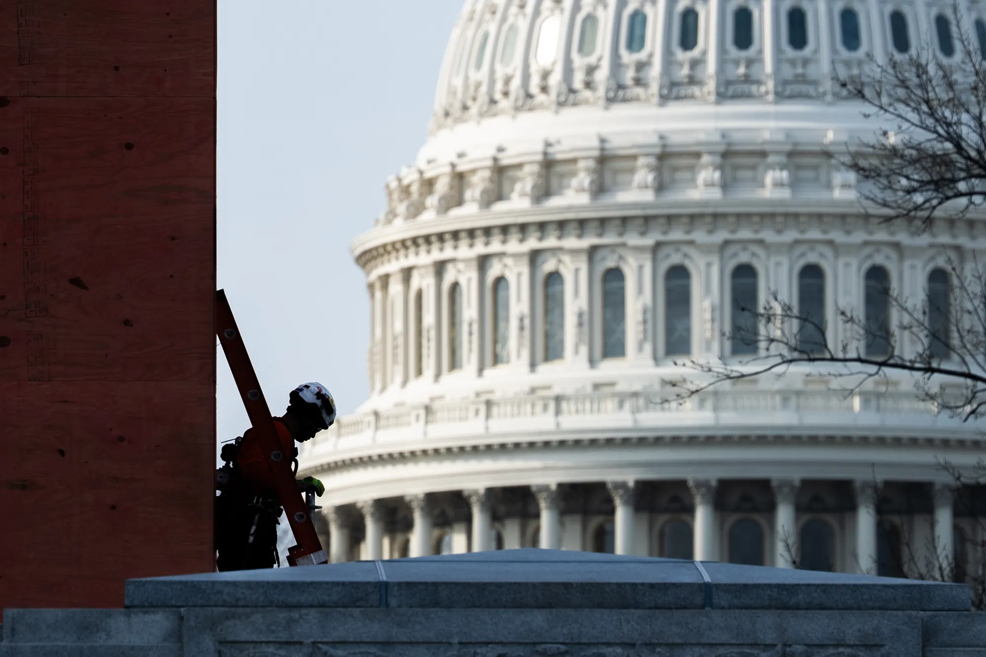 A construction worker takes a break near the Capitol where the House is grappling with ethics cases.