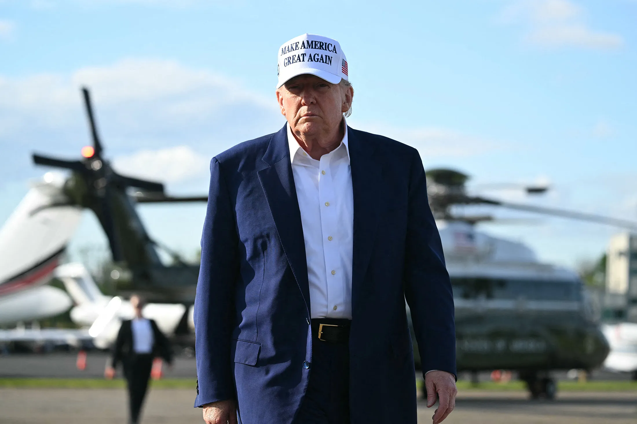 President Donald Trump walks to speak to members of the media&nbsp;before boarding Air Force One at Morristown Municipal Airport in Morristown, New Jersey, on May 25.