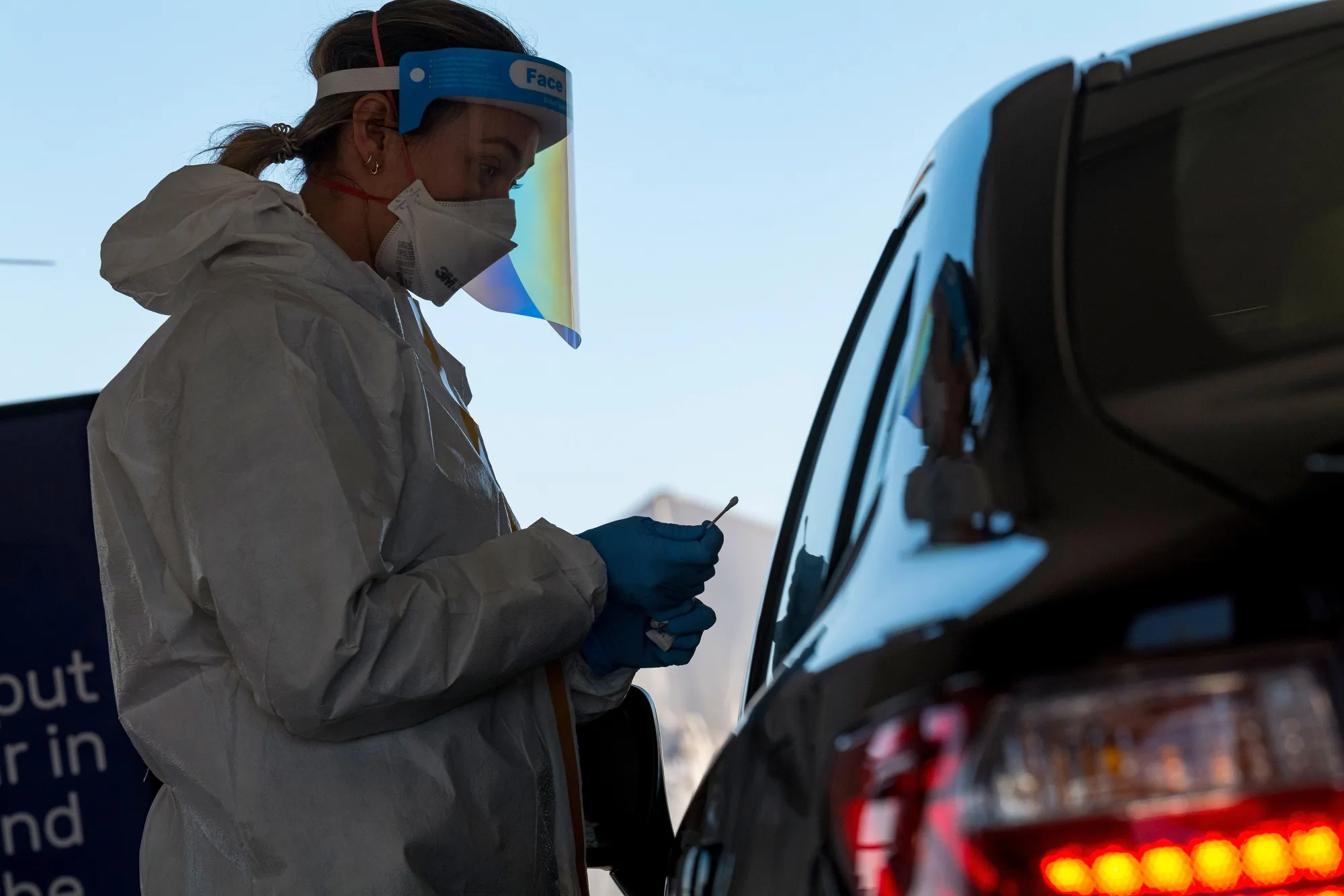 A healthcare worker administers a nasal swab test at a Covid-19 testing site in San Francisco.
