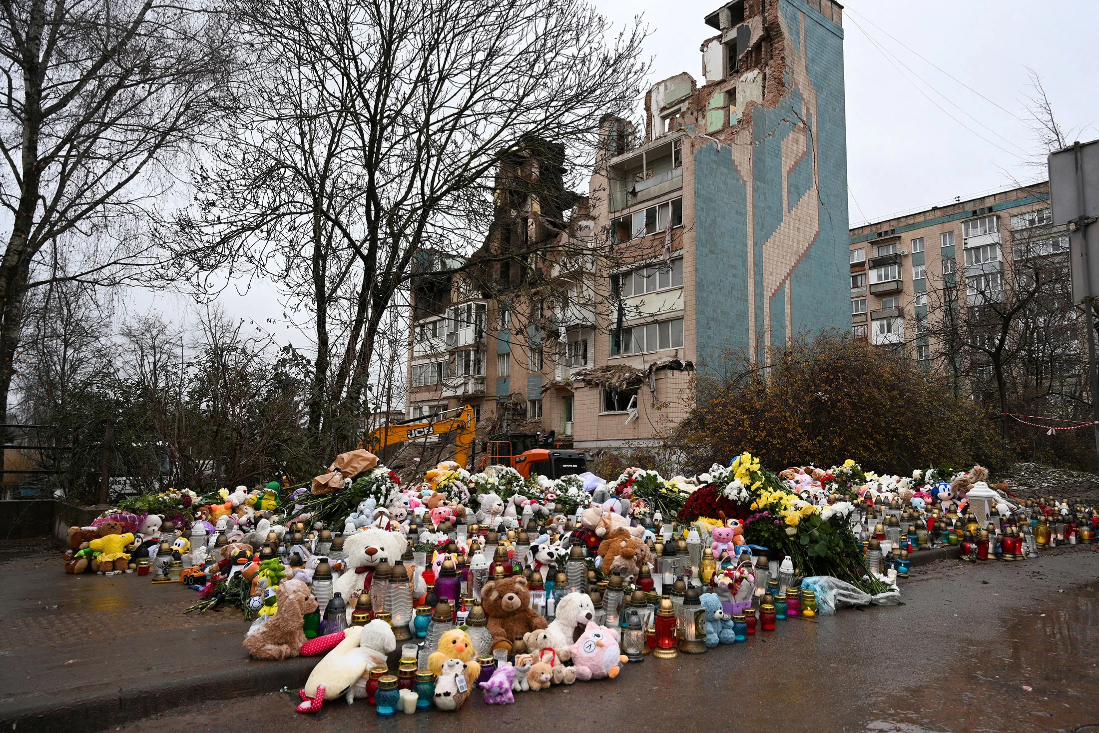 A makeshift memorial near a heavily damaged residential building in Ternopil, Ukraine, on Saturday.