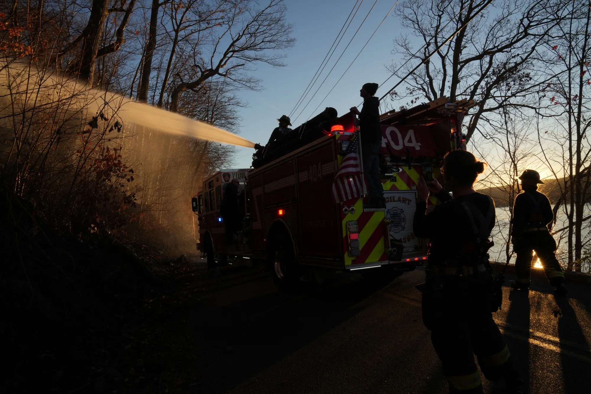 Firefighters from the East Rockaway Fire Department&nbsp;put out a hotspot at the Greenwood Lake fire in Greenwood Lake, New York.