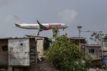 A SpiceJet Ltd. aircraft lands at Chhatrapati Shivaji Maharaj International Airport in Mumbai, India.