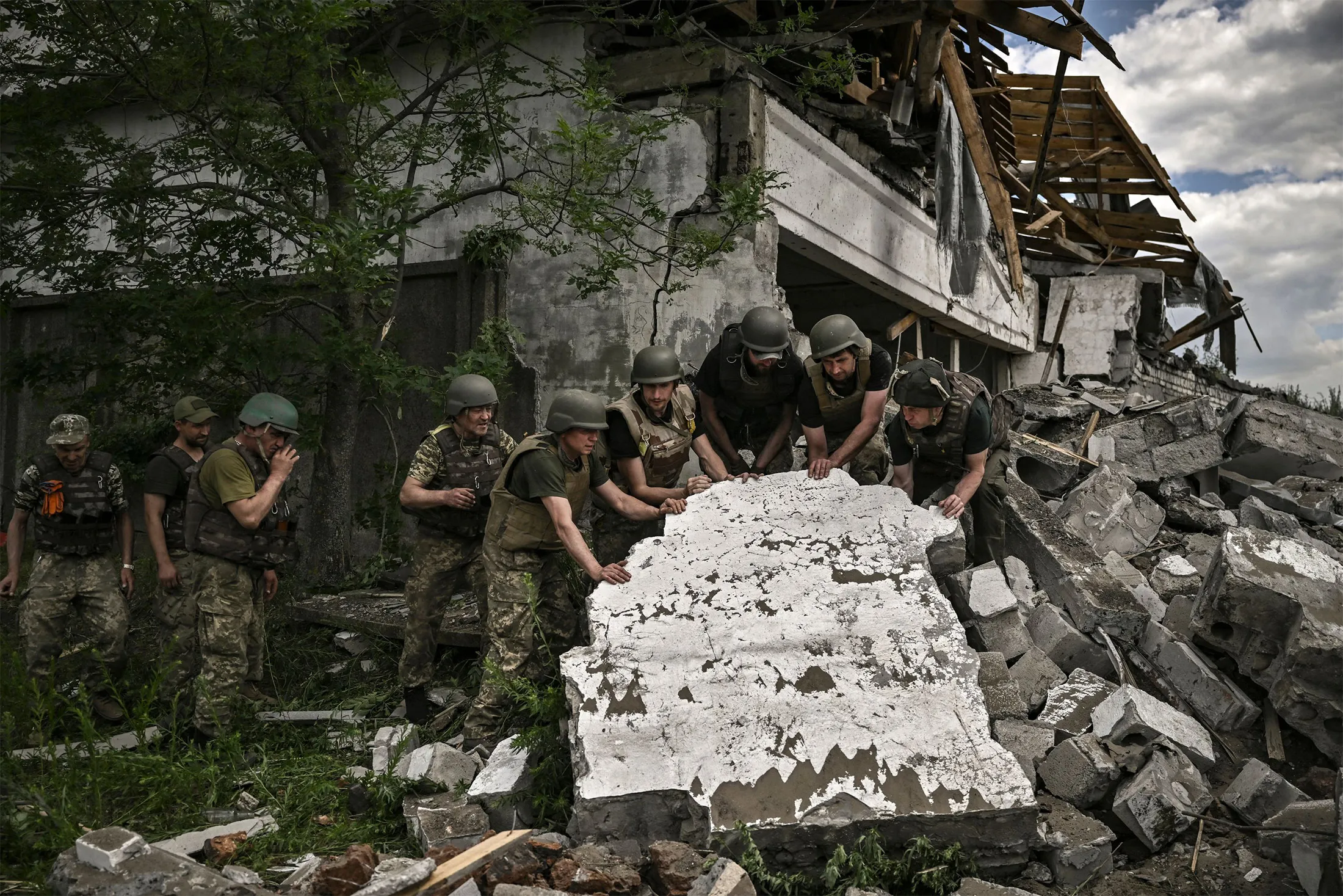 Ukrainian soldiers inspect a destroyed warehouse&nbsp;on outskirts of Lysychansk, in the eastern Ukrainian region of Donbas on June 17.