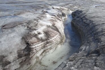 Melt water creek on glacier, Western Greenland.
