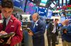 Traders work on the floor of the New York Stock Exchange (NYSE) in New York, U.S., on Tuesday, Sept. 4, 2018. U.S. stocks fell, Treasuries weakened and the dollar climbed as trade tensions persisted and emerging markets remained under pressure.