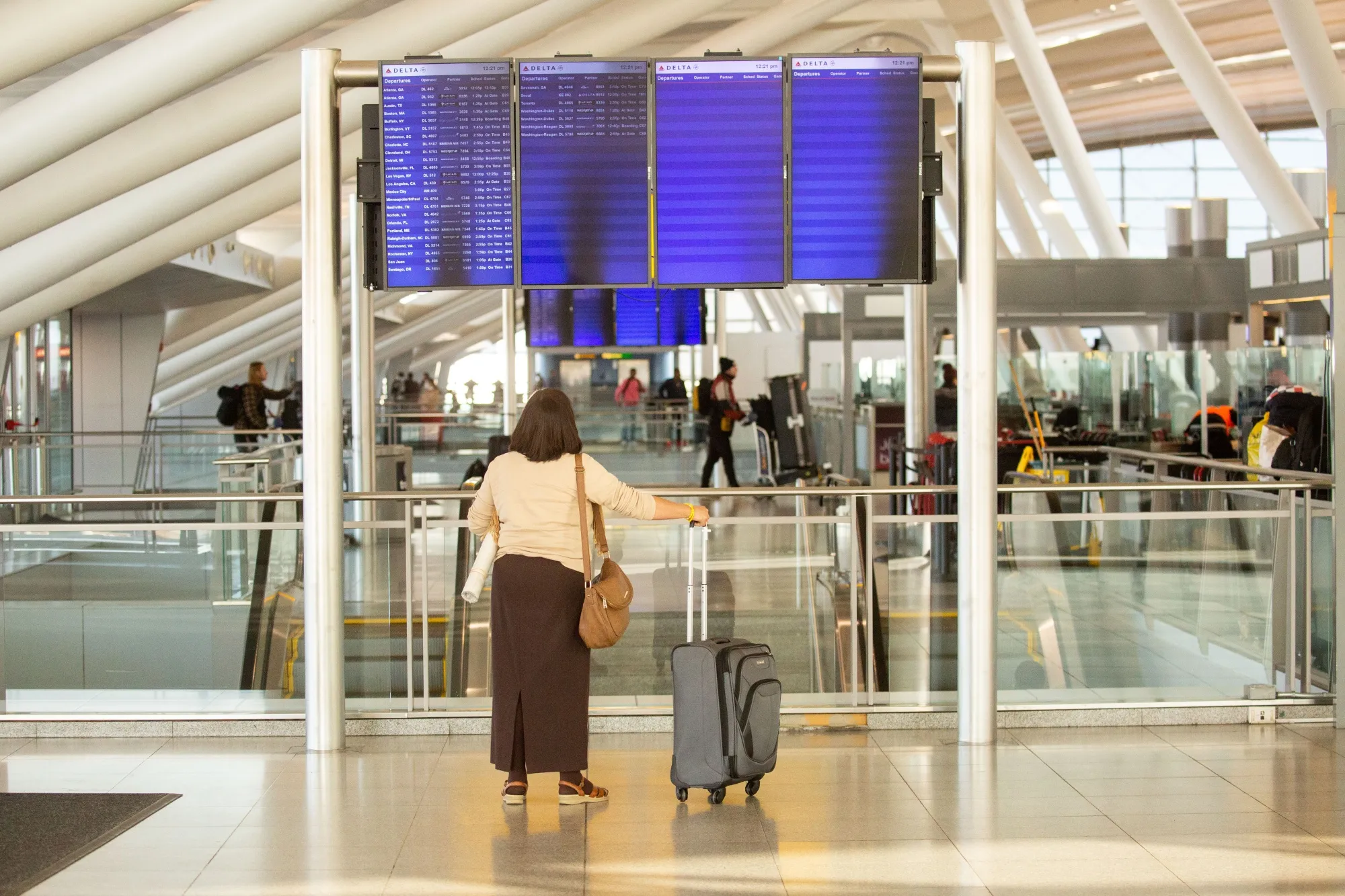 Travelers at&nbsp;John F. Kennedy International Airport in New York.