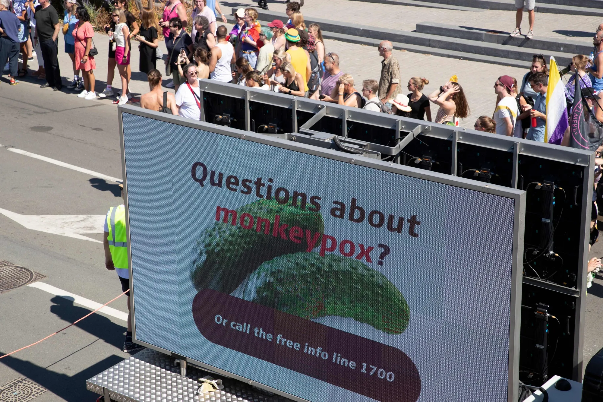 A screen with an info campaign on monkey pox, during the 2022 edition of the 'Antwerp Pride' Parade,’ on Aug. 13.