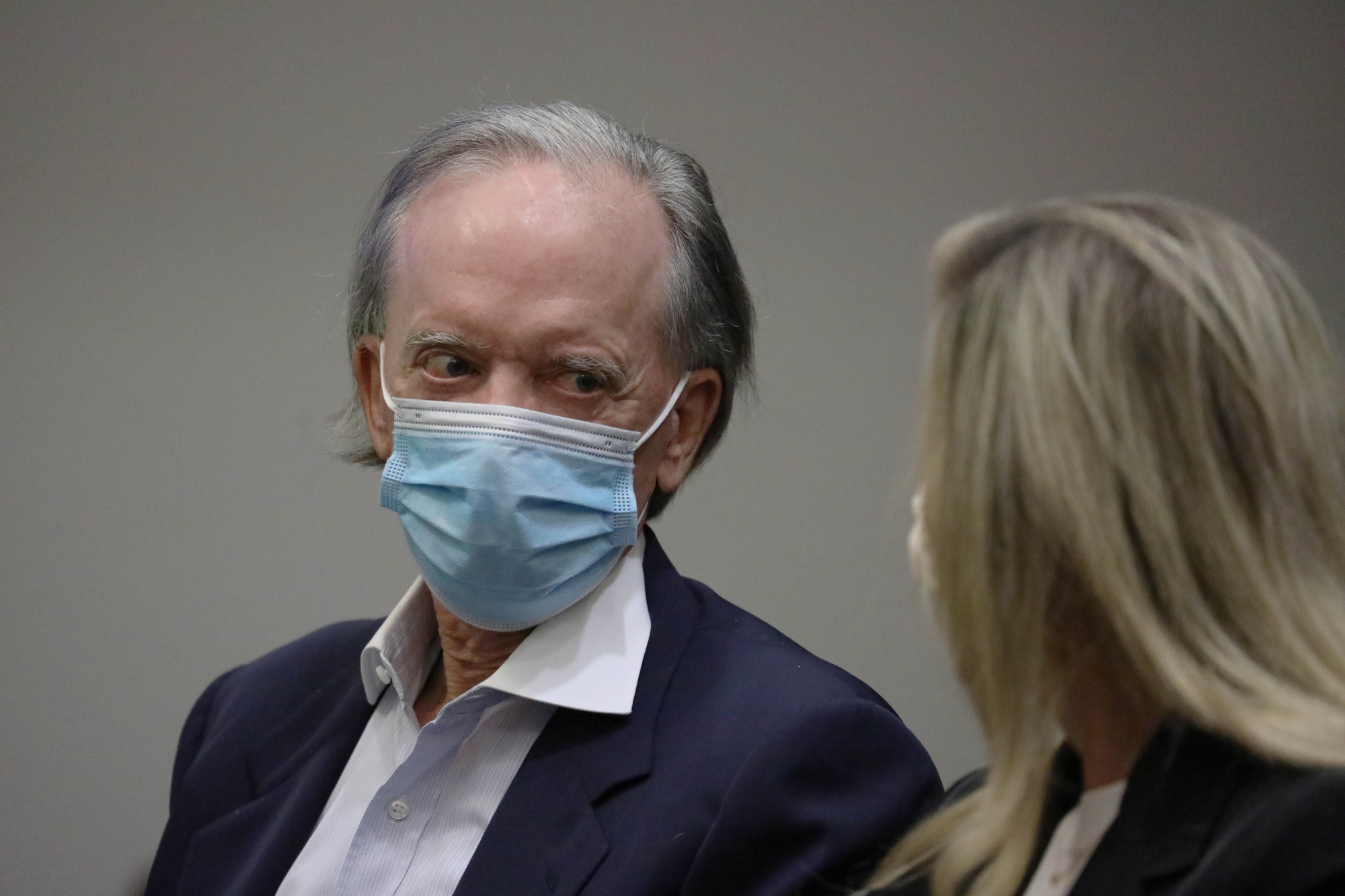Bill Gross, co-founder of Pacific Investment Management Co. (PIMCO), left, and wife Amy Gross at state court in Santa Ana, California, U.S.