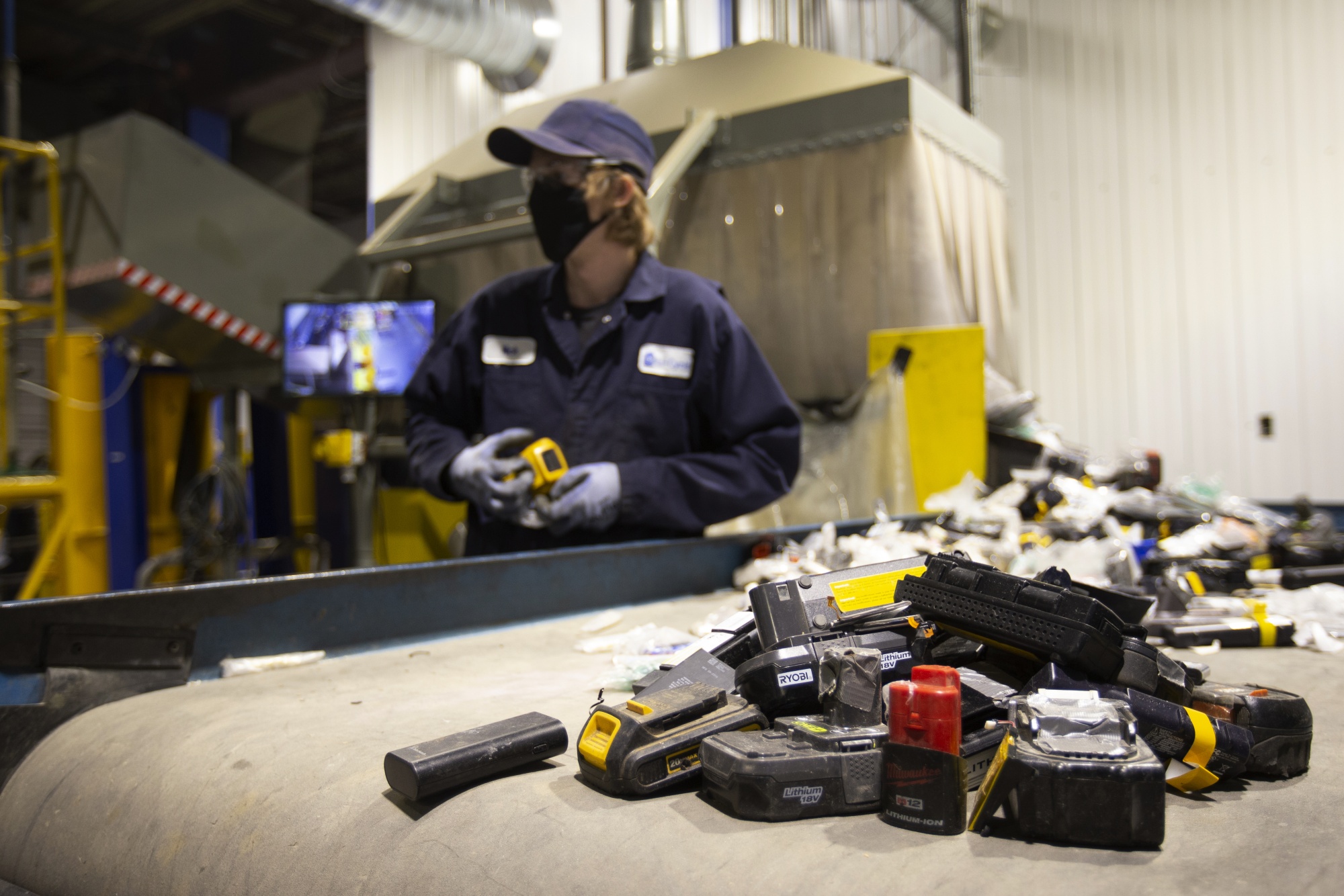 A worker sorts batteries at the Li-Cycle recycling facility in Kingston, Ontario on Feb. 19.