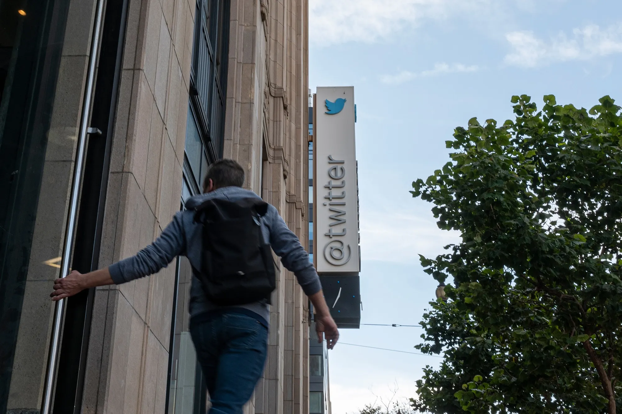A pedestrian outside Twitter headquarters in San Francisco.