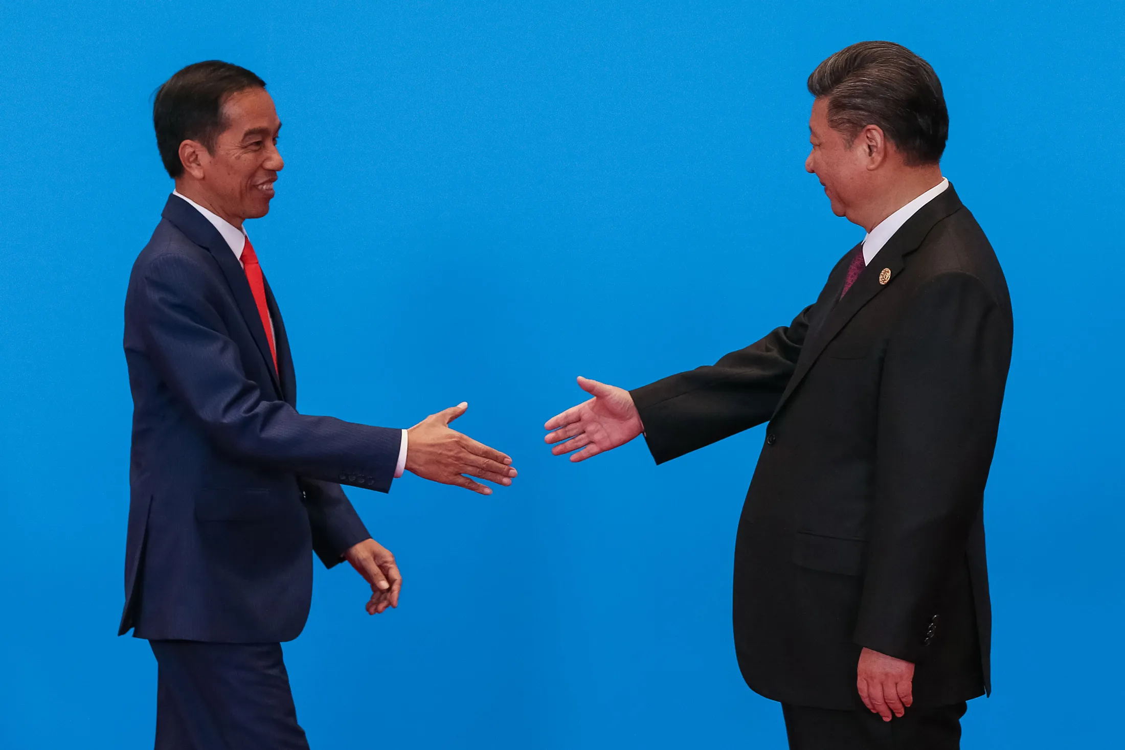 Xi Jinping, right, prepares to shake&nbsp;hands with&nbsp;Joko Widodo in Beijing in 2017.&nbsp;