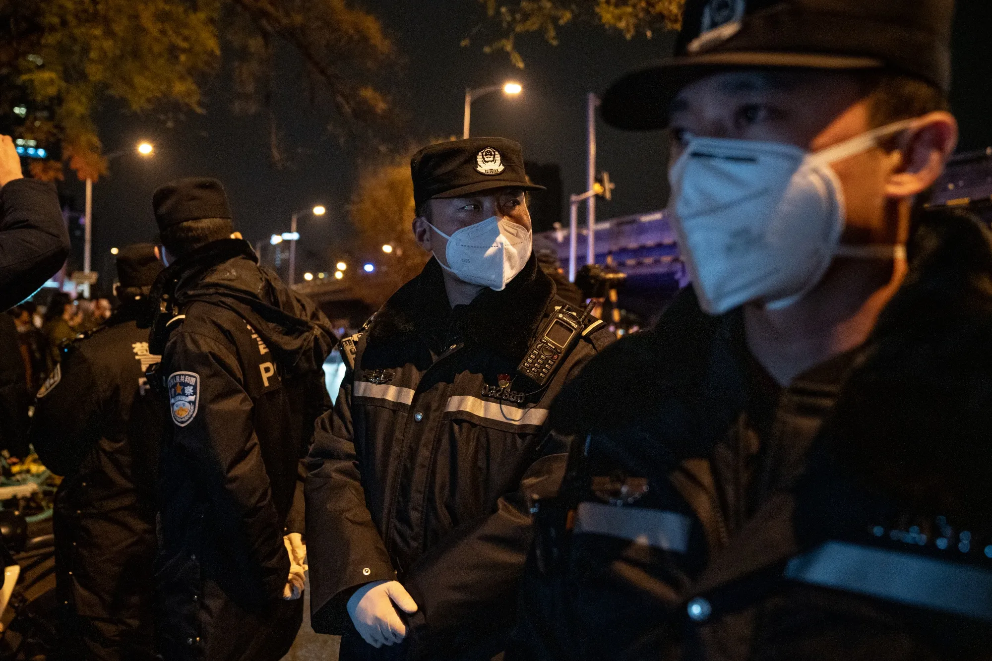 Police officers during a protest in Beijing, on Nov 28.