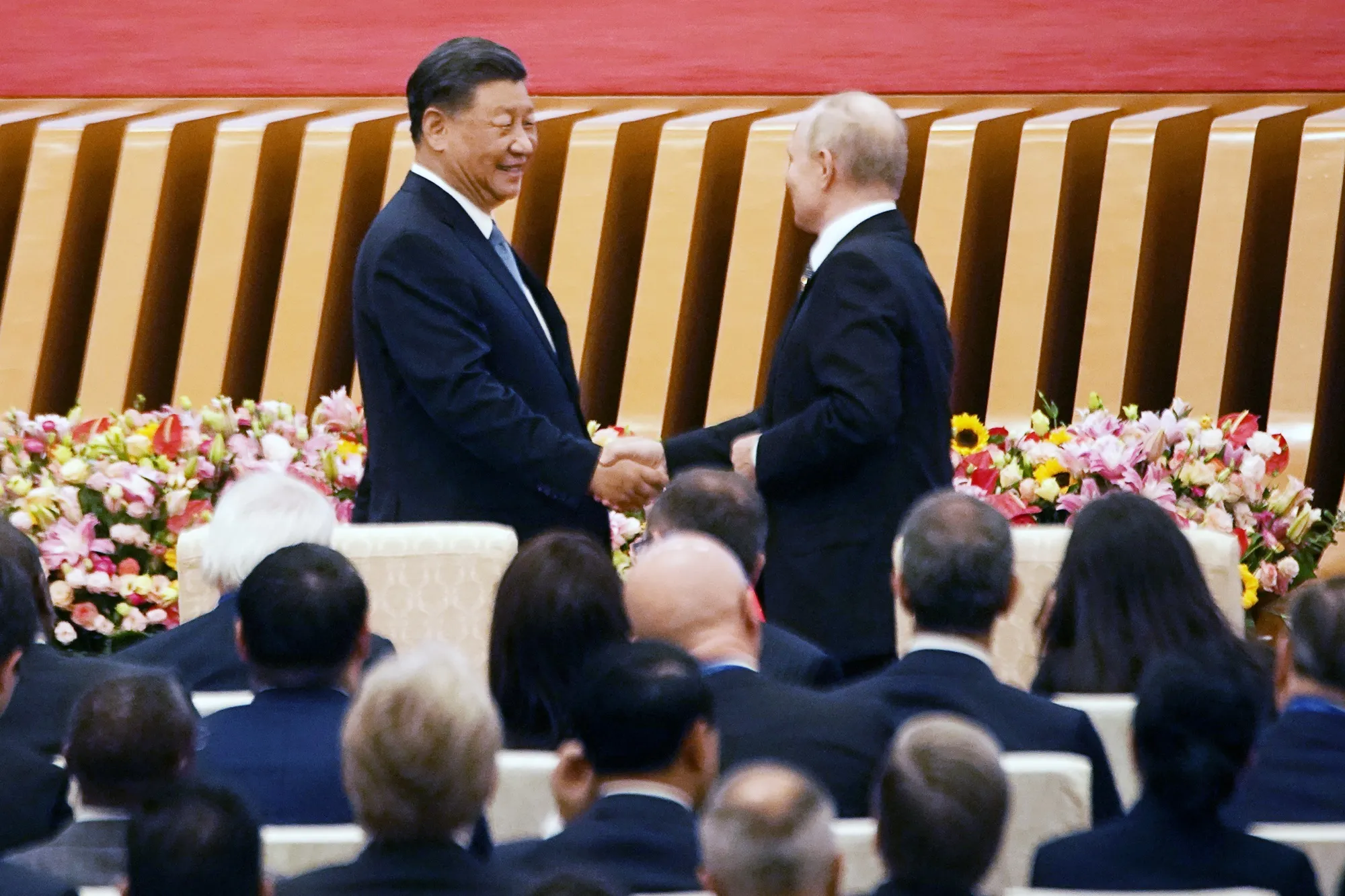 Xi Jinping&nbsp;shakes hands with Vladimir Putin during the opening ceremony at the Belt and Road Forum in Beijing.