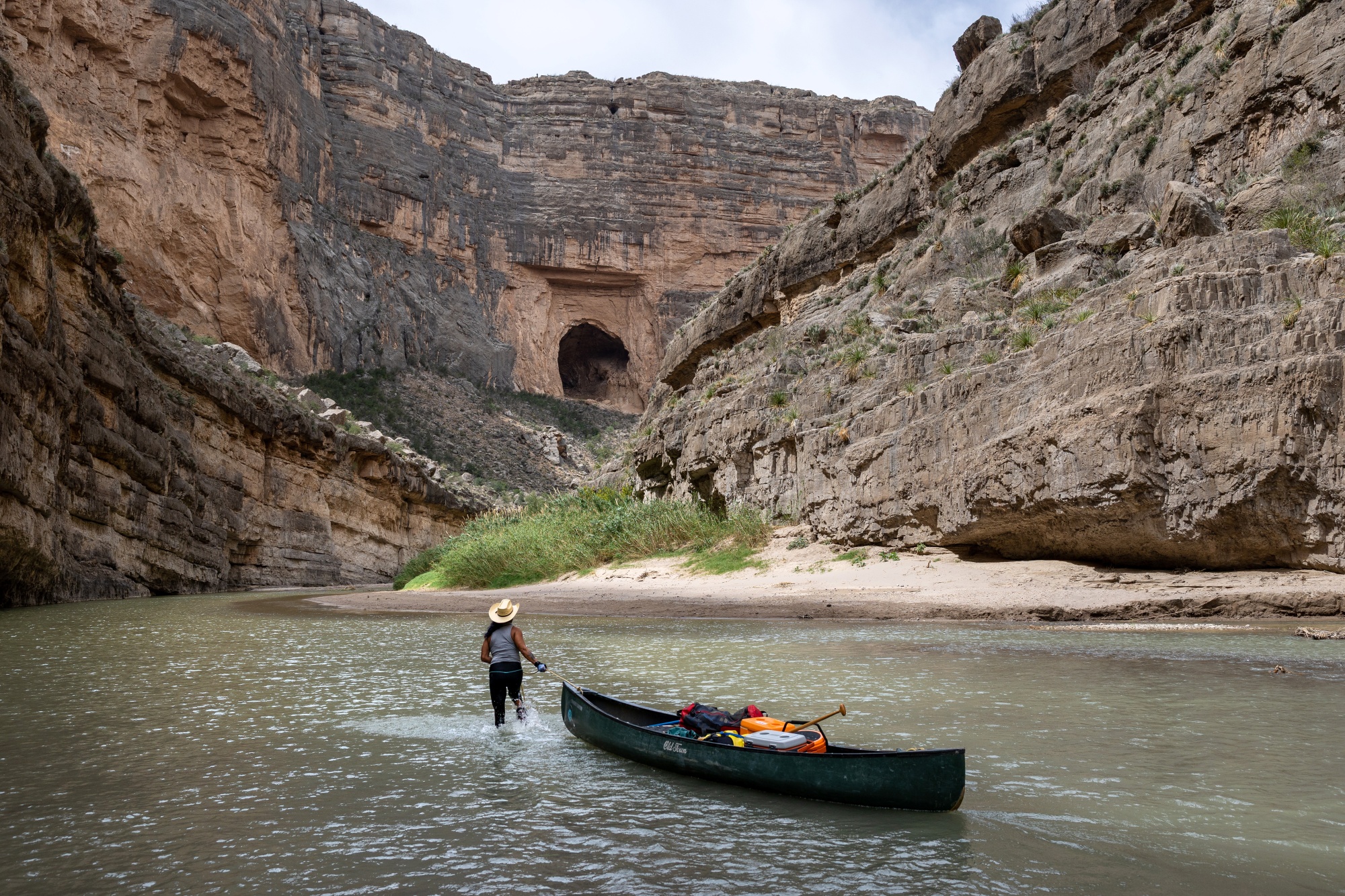 A river guide pulls a canoe through the Rio Grande in the Santa Elena Canyon in Big Bend National Park, Texas, in April. Photographer: John Moore/Getty Images