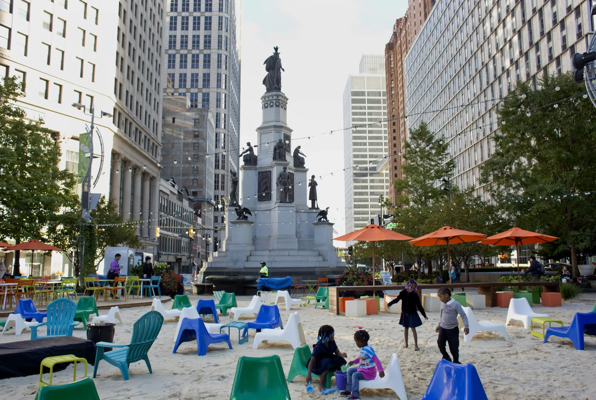 Children play in the sand at Campus Martius park in downtown Detroit. The city’s bankruptcy set the stage for a revival that might be a model for other U.S. cities in the post-pandemic era.&nbsp;