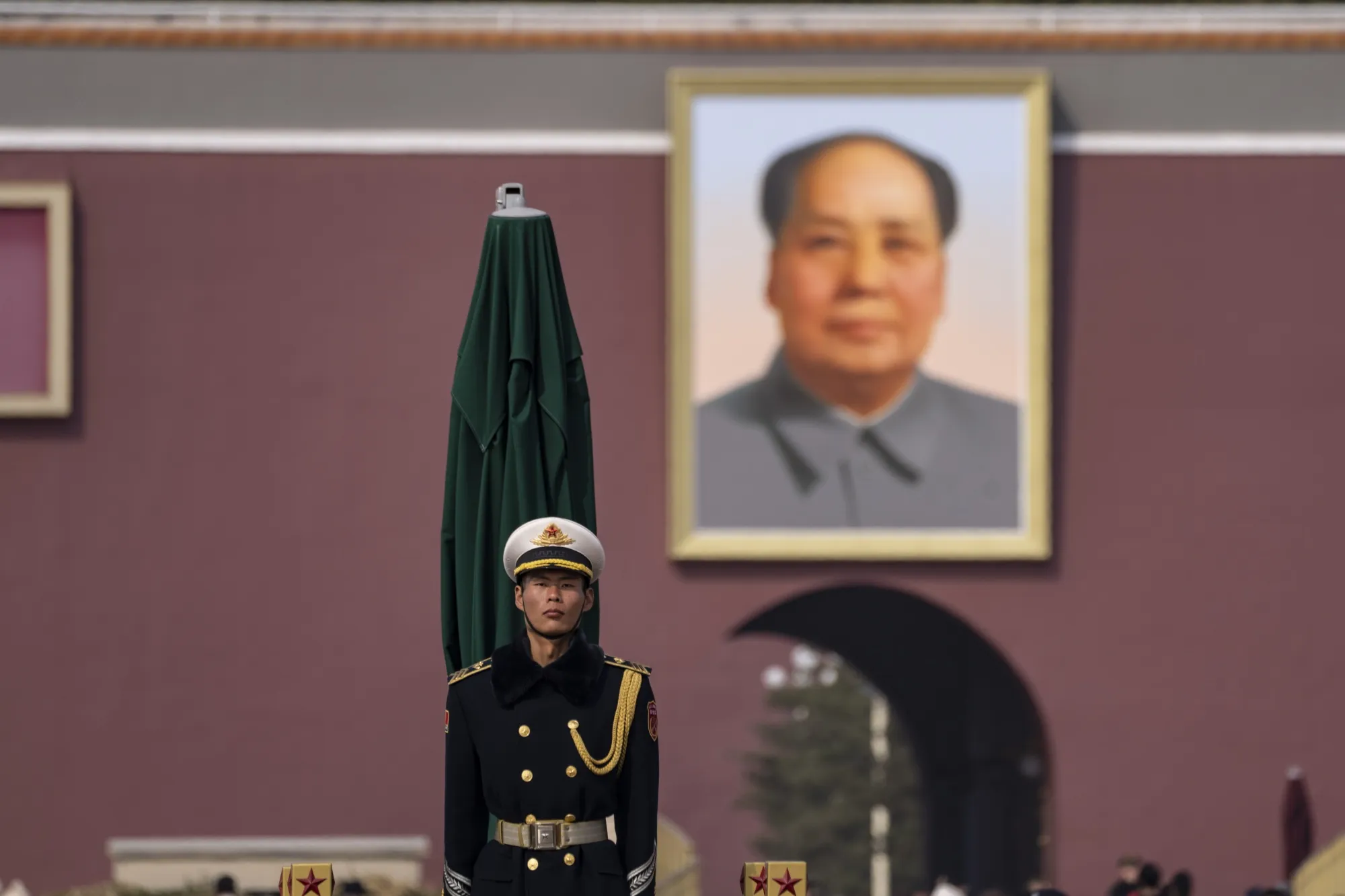 A member of the People’s Liberation Army Color Guard stands guard in Tiananmen Square in Beijing on March 12.