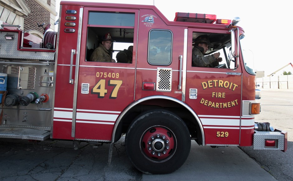 A Detroit fire engine leaves the station on a call in 2013.