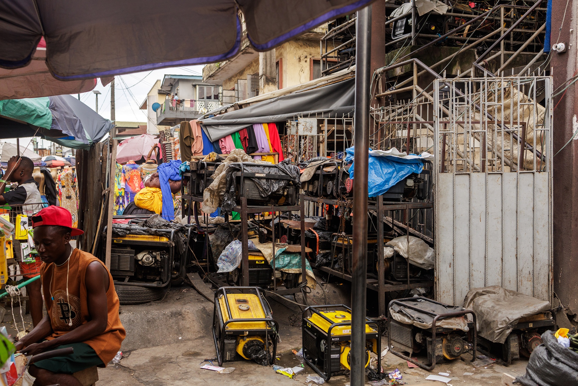 Generators stacked and in use at a market in Yaba, Lagos.