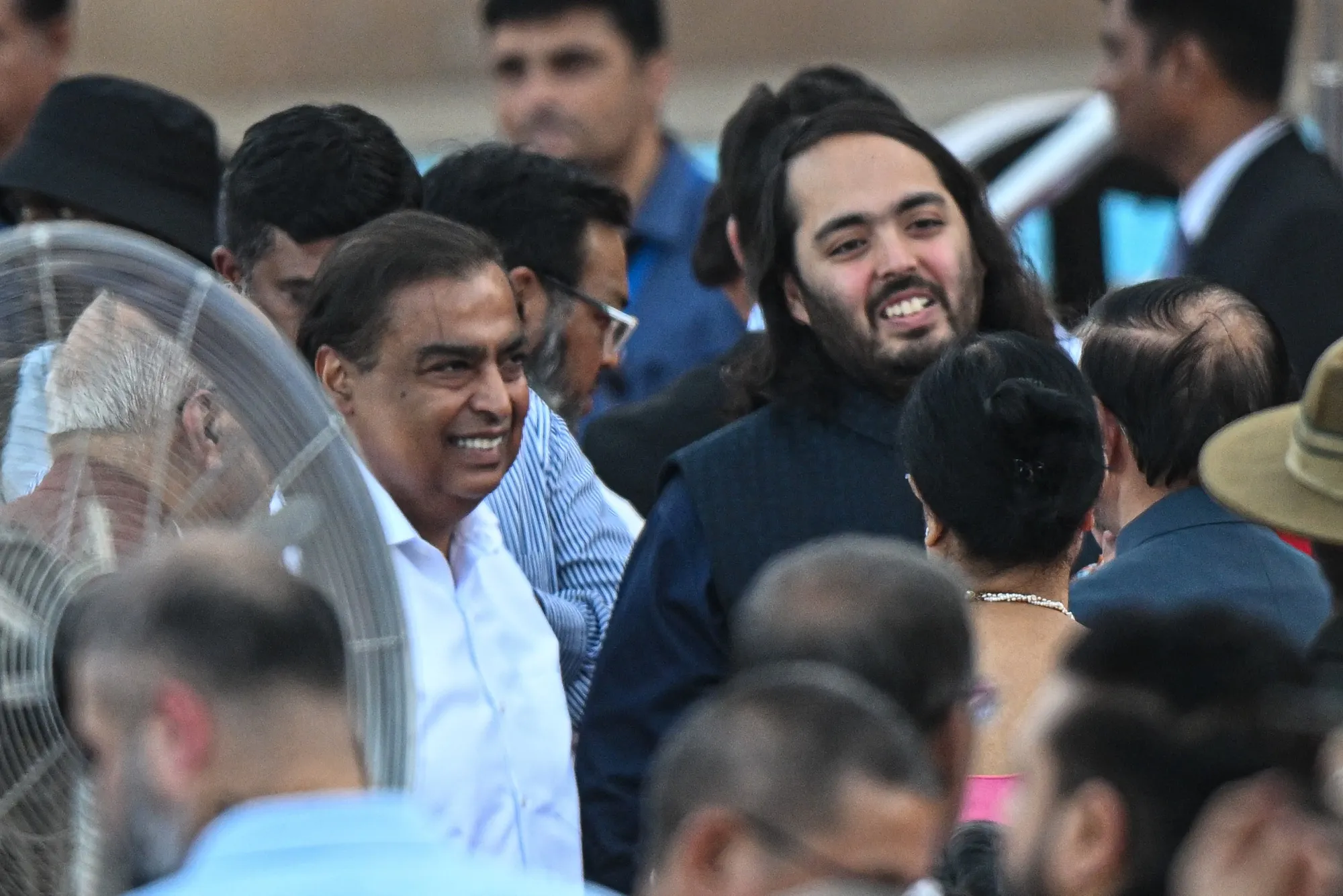 Mukesh Ambani, left, with Anant Ambani in 2024.