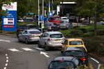 Vehicles queue for fuel at a service station in London on Sept. 26.