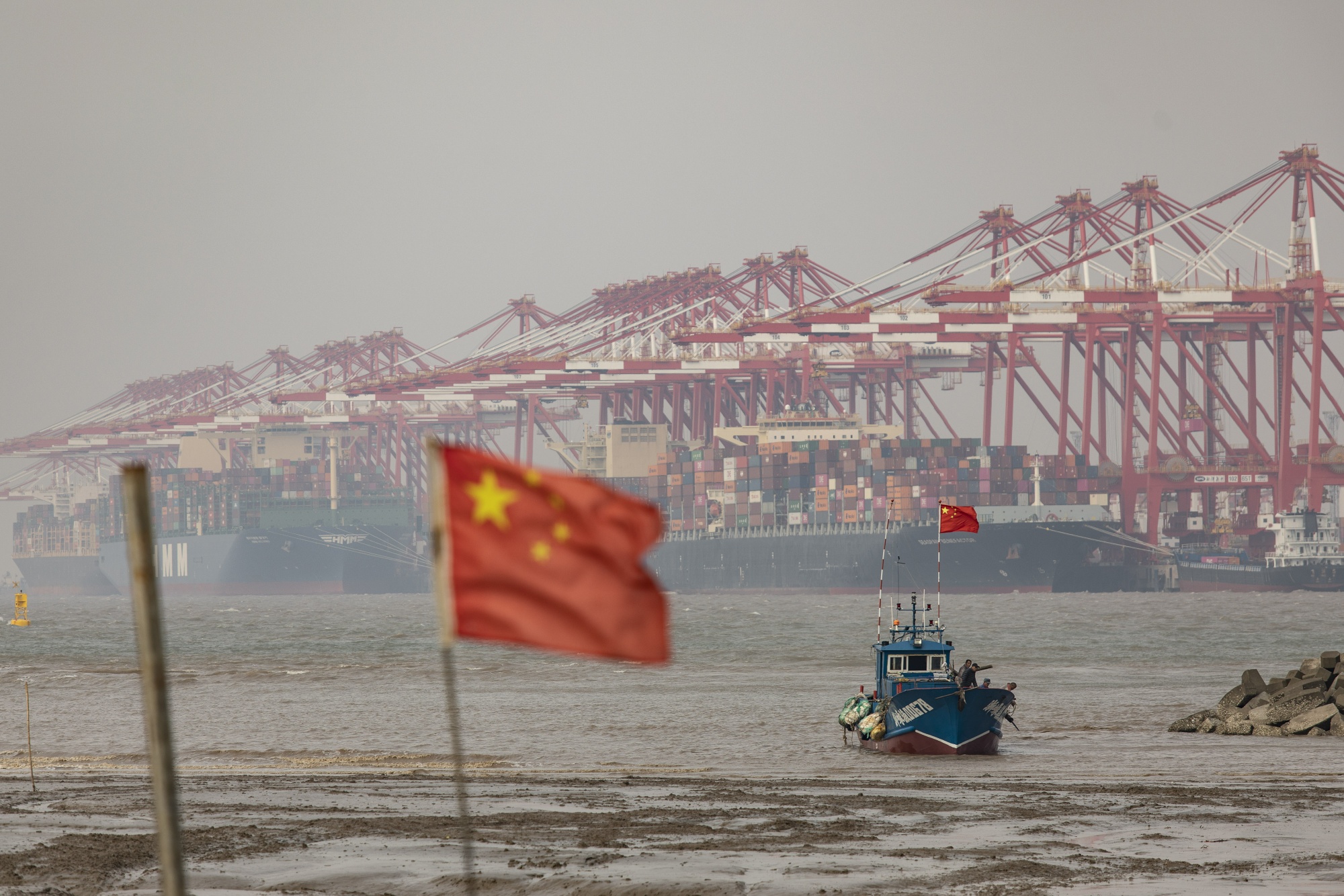 The Yangshan Deepwater Port in Shanghai. China’s manufactured goods surplus relative to global GDP is now around 30%, about as large as the US’s was after World War II.